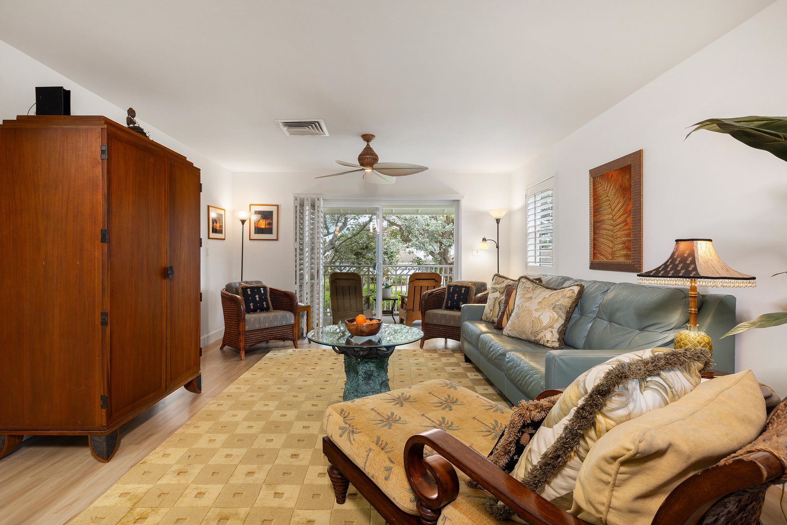Kapolei Vacation Rentals, Ko Olina Kai 1105E - Sink into plush seating in your thoughtfully furnished living room, where natural light and garden views create a warm, relaxing retreat after a day of exploring.