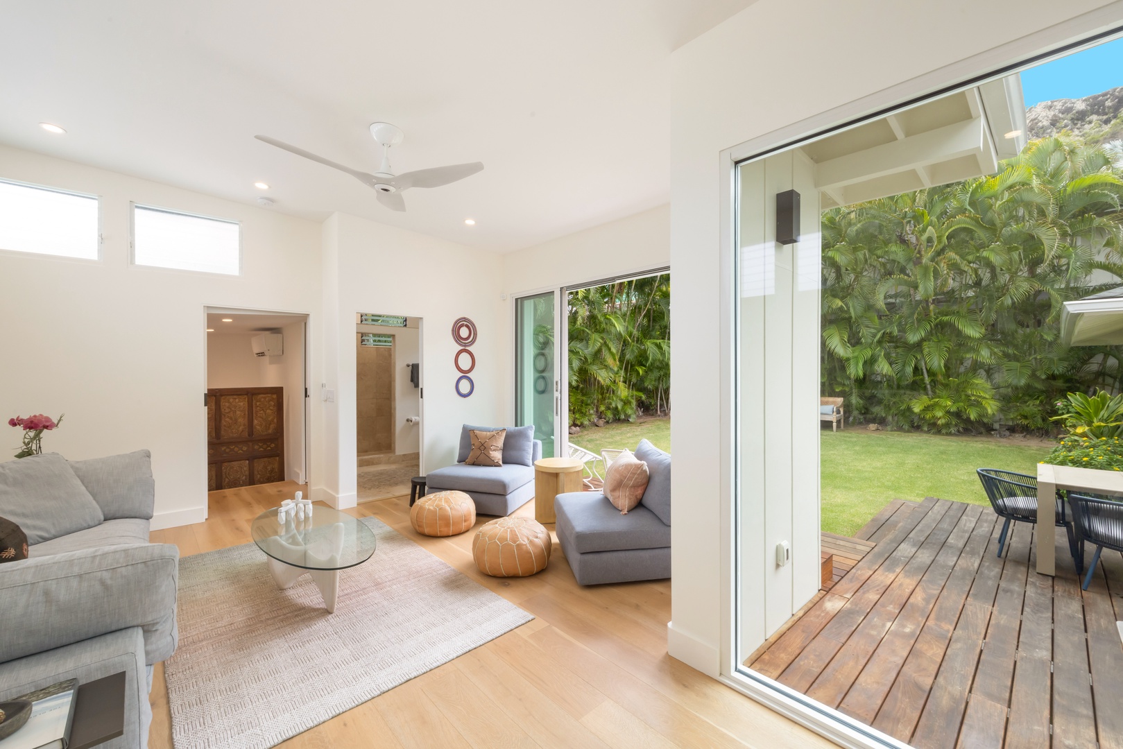 Kailua Vacation Rentals, Lanikai Ola Nani - Experience the luxury of space in our light-filled open living area, anchored by cozy seating and mountain-view access.