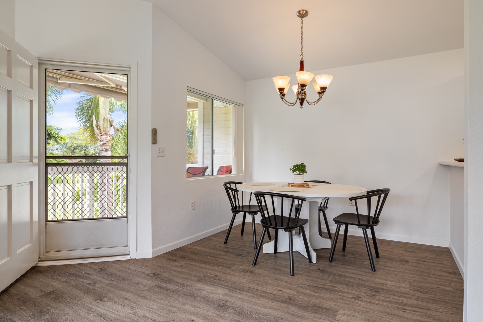Kapolei Vacation Rentals, Fairways at Ko Olina 7A - Your bright dining space opens to tropical views, perfect for morning coffee or evening meals with loved ones.