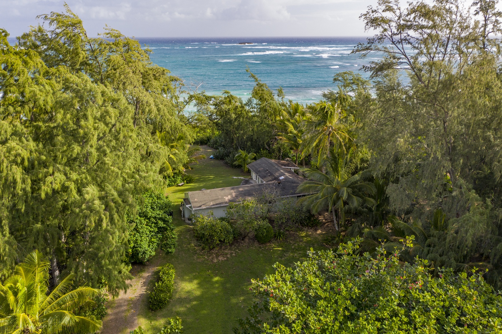 Kahuku Vacation Rentals, Hale Ula Ula - View of entire property, which sits on an area of land.
