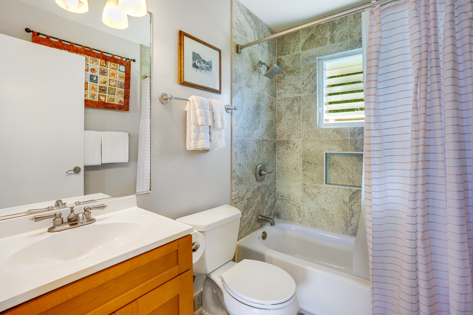 Princeville Vacation Rentals, Alii Kai 7201 - The en-suite bathroom, with its modern fixtures and clean lines, adds a touch of luxury to your daily routine.