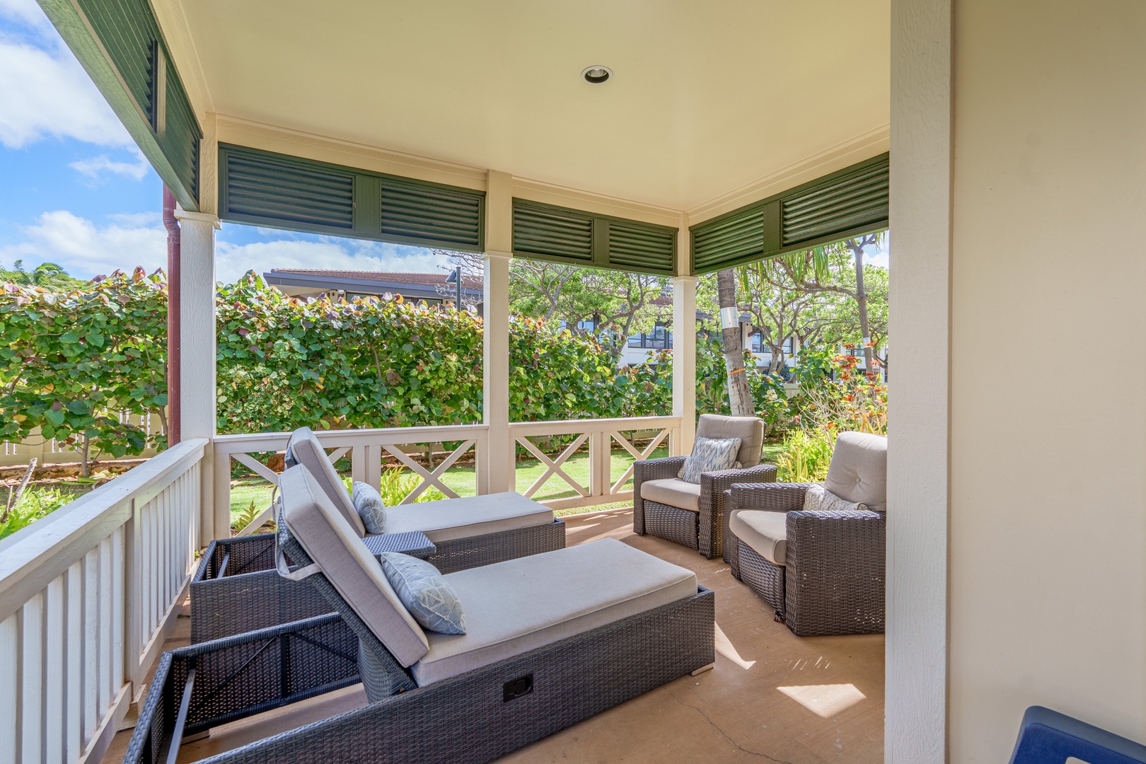 Kapolei Vacation Rentals, Coconut Plantation 1078-1 - The relaxing garden view from the lanai with plush seats, a perfect spot for relax and Gather.