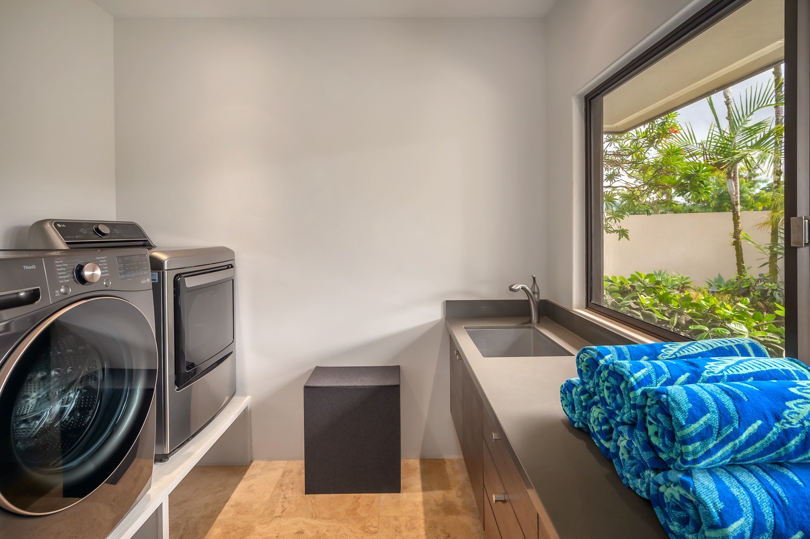 Princeville Vacation Rentals, Hanalei Plantation Villa - Laundry room equipped with modern amenities, including washer, dryer, and plenty of storage space.