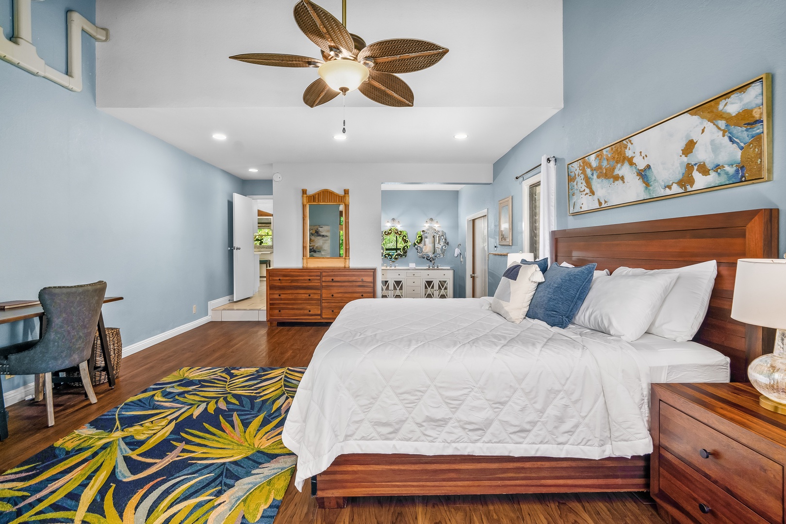 Princeville Vacation Rentals, Mauna Kai 7B - Sink into crisp white and blue linens while the ceiling fan does the rest of the work.