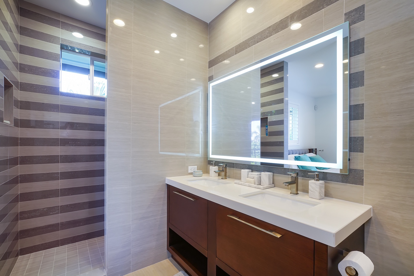 Honolulu Vacation Rentals, Diamond Head Villa* - Guest bathroom with dual sinks, LED mirror, and designer tile for a spa-like refresh.