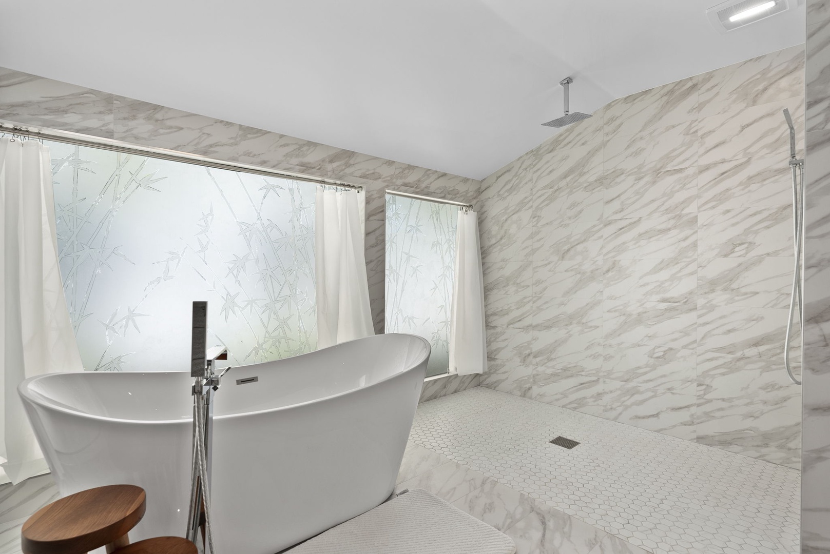 Honolulu Vacation Rentals, Honolulu Lagoonfront Villa - Unwind in the deep soaking tub after a day at the beach—set against gleaming marble at Honolulu Lagoonfront Villa.