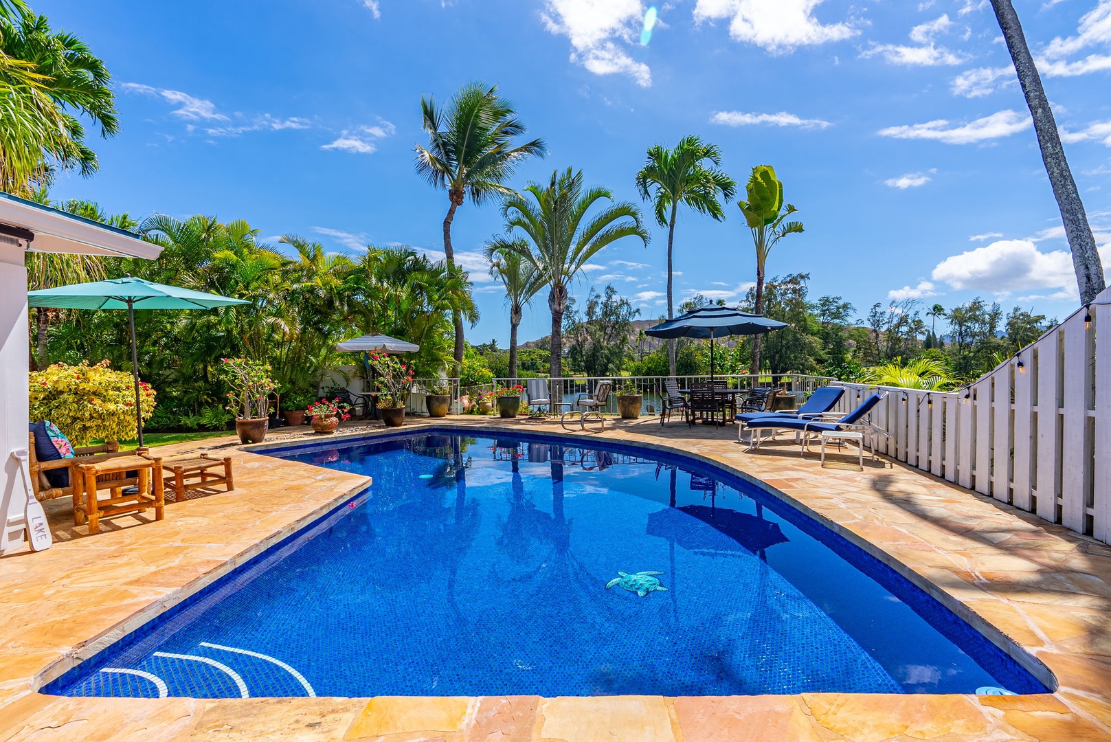 Kailua Vacation Rentals, Hale Aloha - Relax and unwind by the inviting pool, complemented by comfortable chaise lounges.