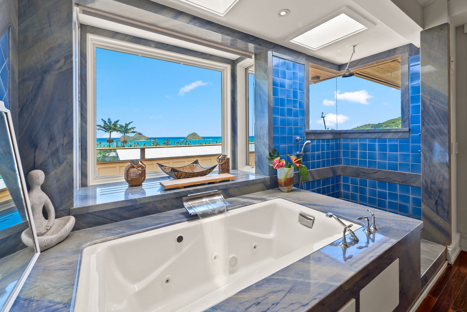 Kailua Vacation Rentals, Leaf House - Slip into the soaking tub and let turquoise ocean views and tropical breezes melt away your worries. Vibrant blue tilework and skylights create a serene, spa-like haven.