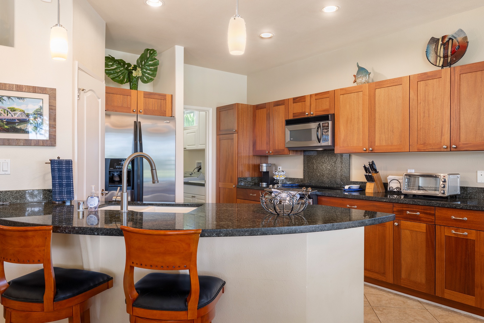 Your gourmet kitchen features granite countertops, stainless steel appliances, and a breakfast bar where you'll enjoy morning coffee.