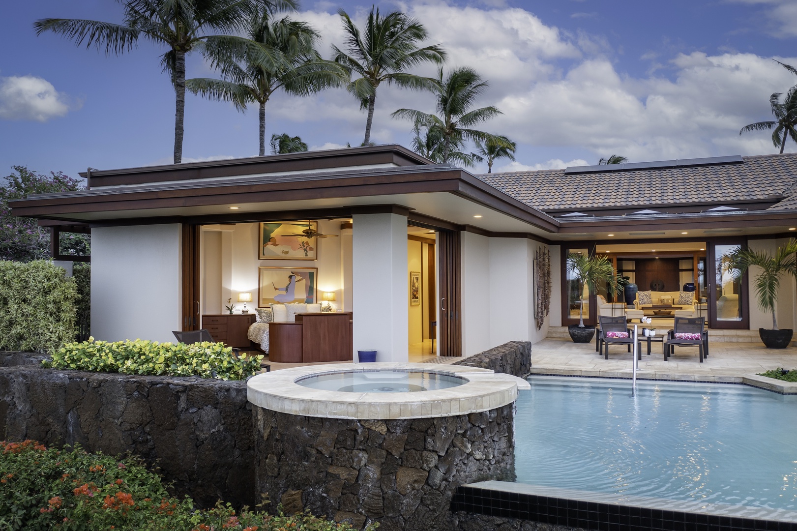 Kamuela Vacation Rentals, Champion Ridge 7 - Modern villa with private pool and hot tub surrounded by tropical palms and lush landscaping in paradise setting.