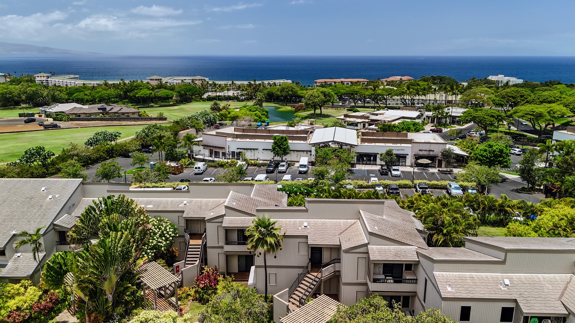 Kihei Vacation Rentals, Wailea Ekolu 204 - Shops and a coffee stop sit an easy walk across the lot, the golf course pond and open ocean stretching out beyond.
