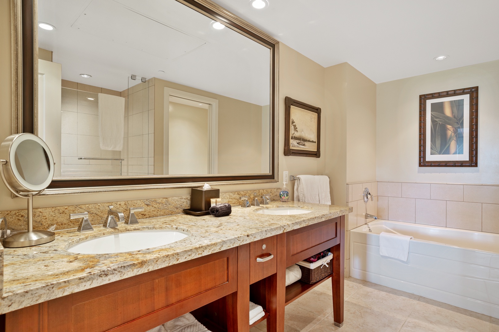 Lahaina Vacation Rentals, Honua Kai Konea 204 - The guest room ensuite bathroom has dual vanities and a soaking tub.