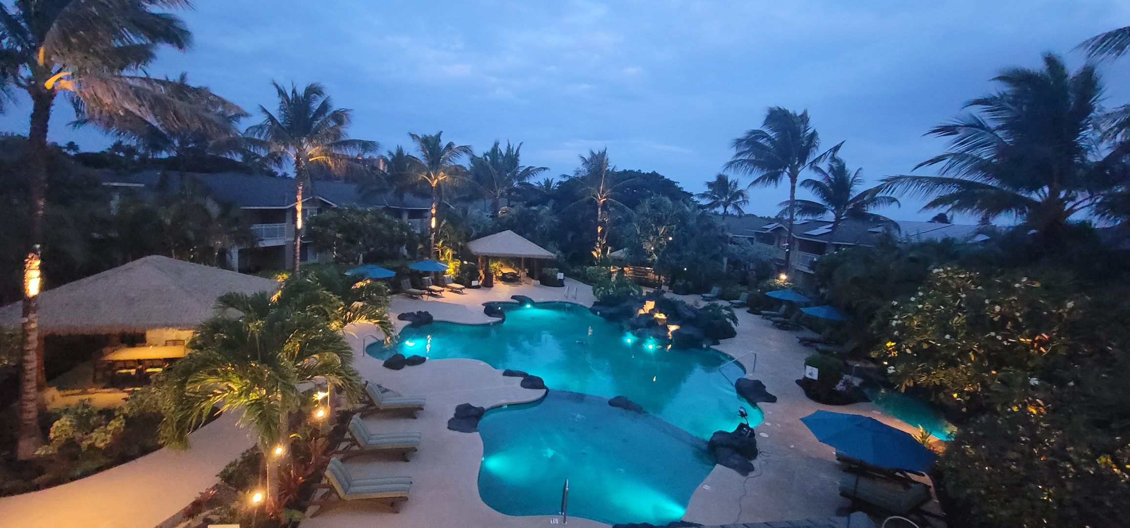 Kapolei Vacation Rentals, Ko Olina Kai 1033A - An aerial view of the pool and lounge chairs at the resort.