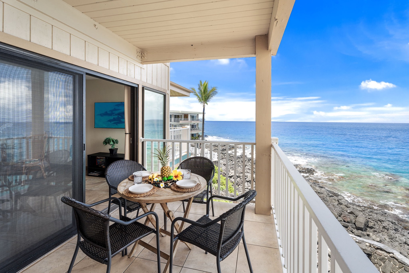 Kailua Kona Vacation Rentals, Sea Village 4213 - Dine al fresco as spinner dolphins and sailboats drift by—this second-floor lanai is your front-row seat to the Pacific.