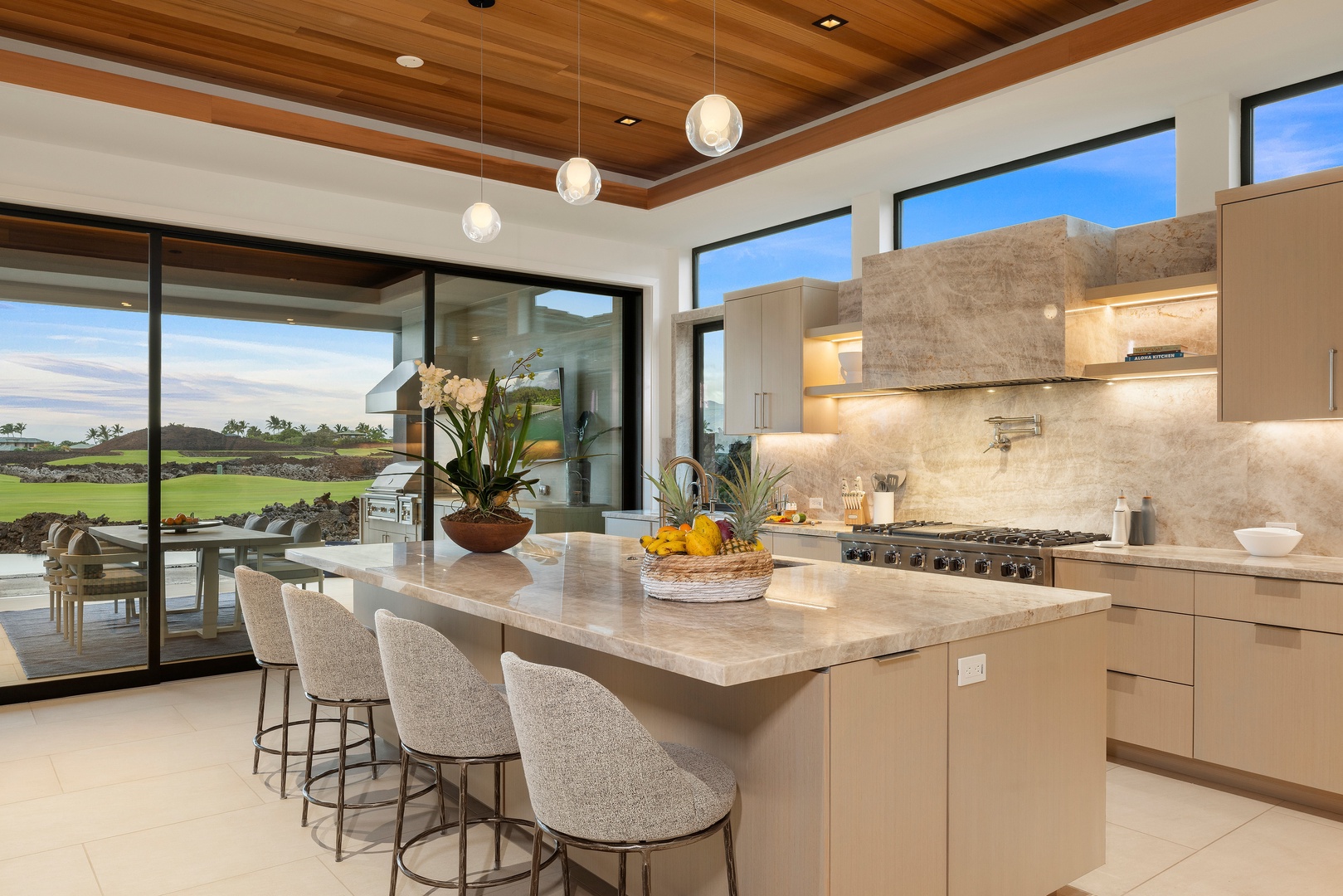 Kamuela Vacation Rentals, 6BD Mauna Lani Lux Golf Estate (6) at One Ocean - The oversized island naturally becomes the day's meeting place, from morning coffee to evening cocktails.