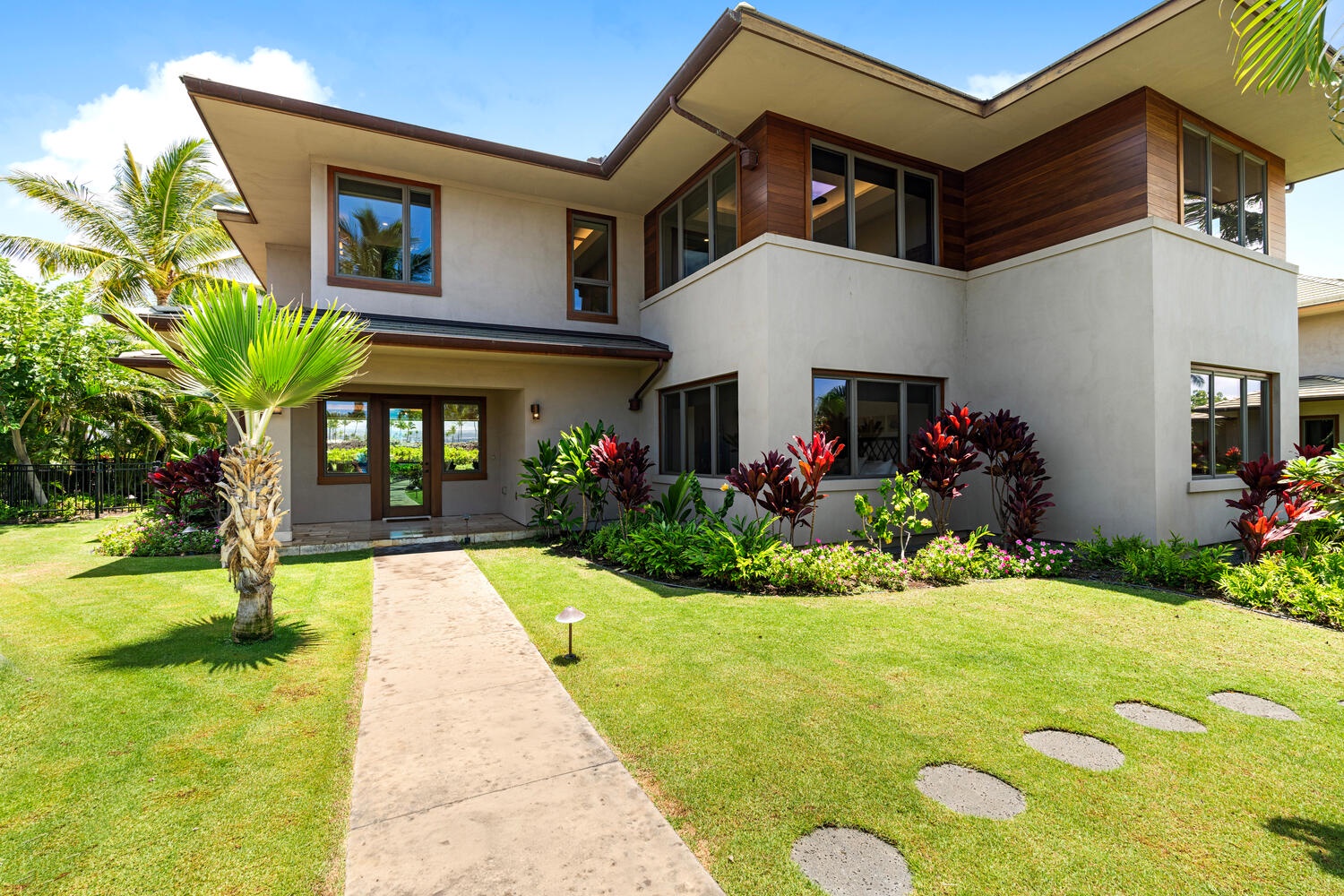 Kamuela Vacation Rentals, Laule'a Ohana Retreat - Tropical front entry path lined with palms and colorful landscaping at Laule'a #13.