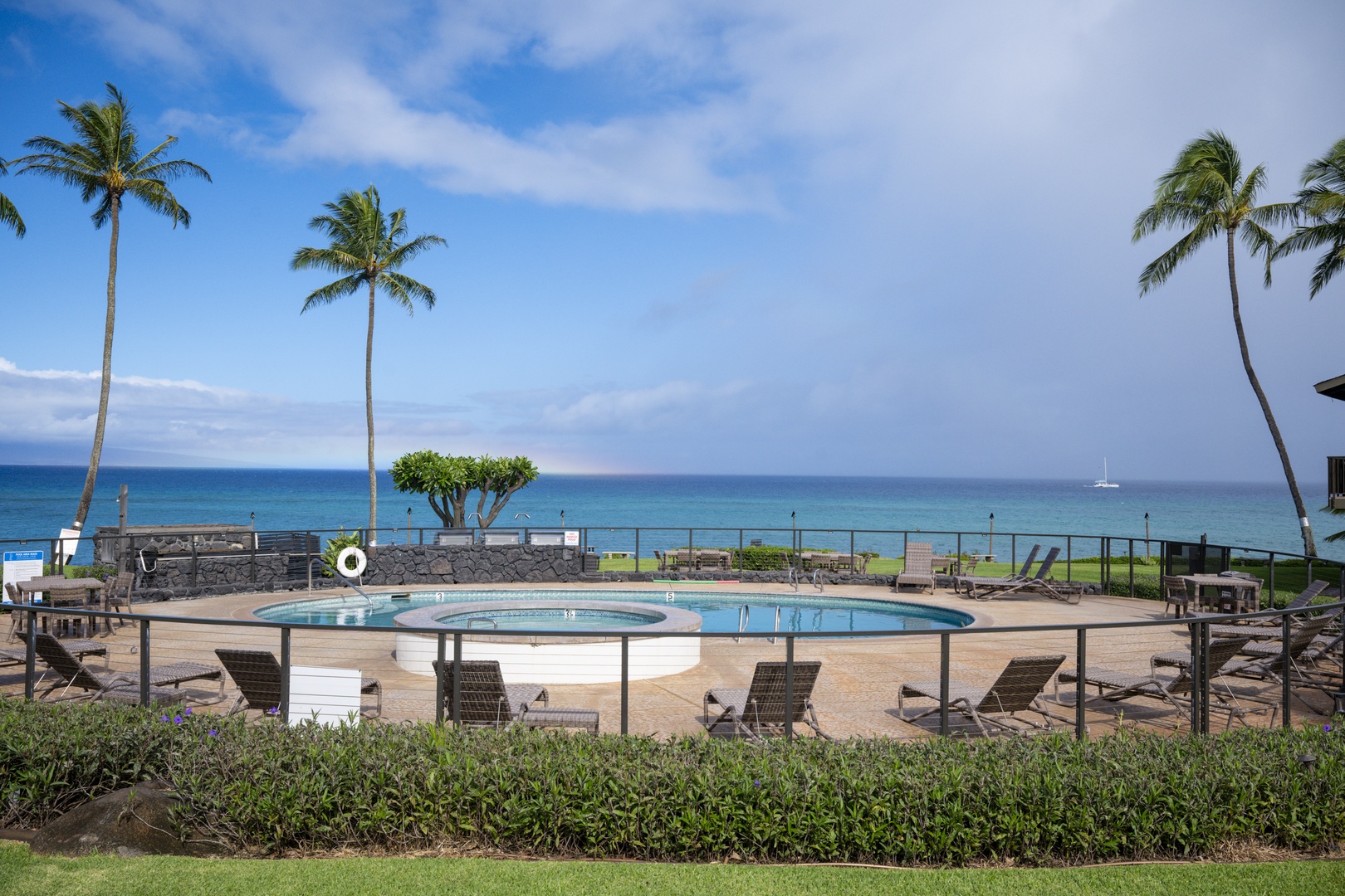 Lahaina Vacation Rentals, Polynesian Shores 114 - Claim a lounger at the pool with the ocean just past the deck.