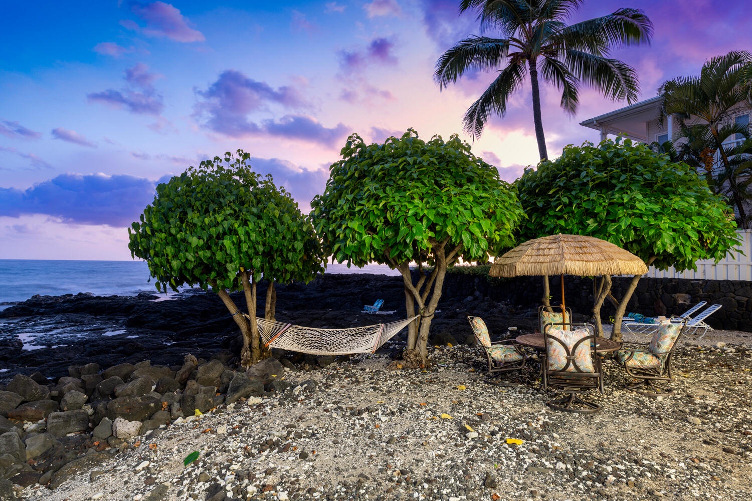 Kailua Kona Vacation Rentals, Kailani Vista - As twilight purples the sky, sip chilled rosé in cushioned chairs framed by swaying coconut trees.
