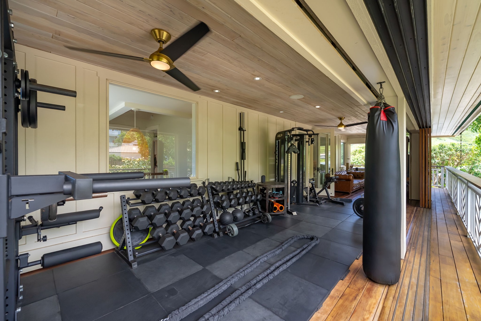 Kailua Vacation Rentals, Leaf House - Your private fitness center awaits with professional equipment, dumbbells, a punching bag, and mirror—perfect for staying active during your stay.
