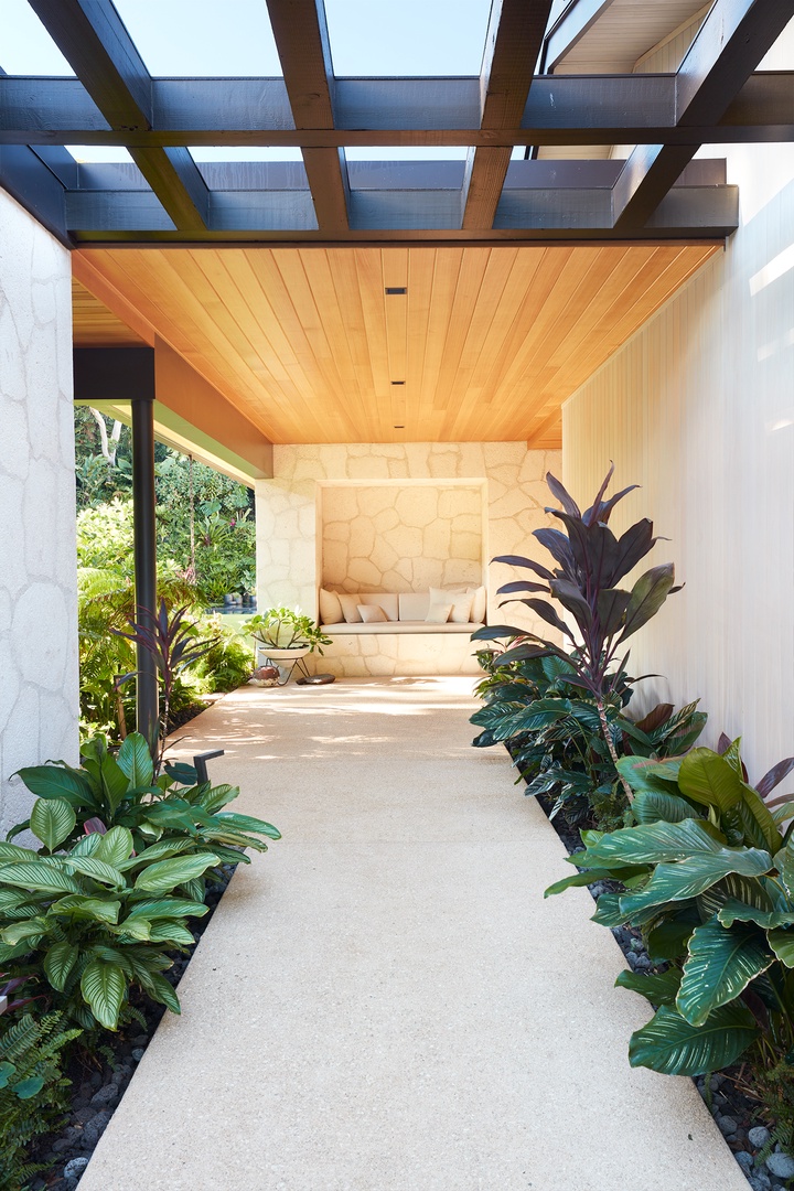 Honolulu Vacation Rentals, Diamond Head Hillside Estate** - A beautifully designed covered walkway welcomes you home, blending warm natural materials, tropical landscaping, and contemporary island architecture.