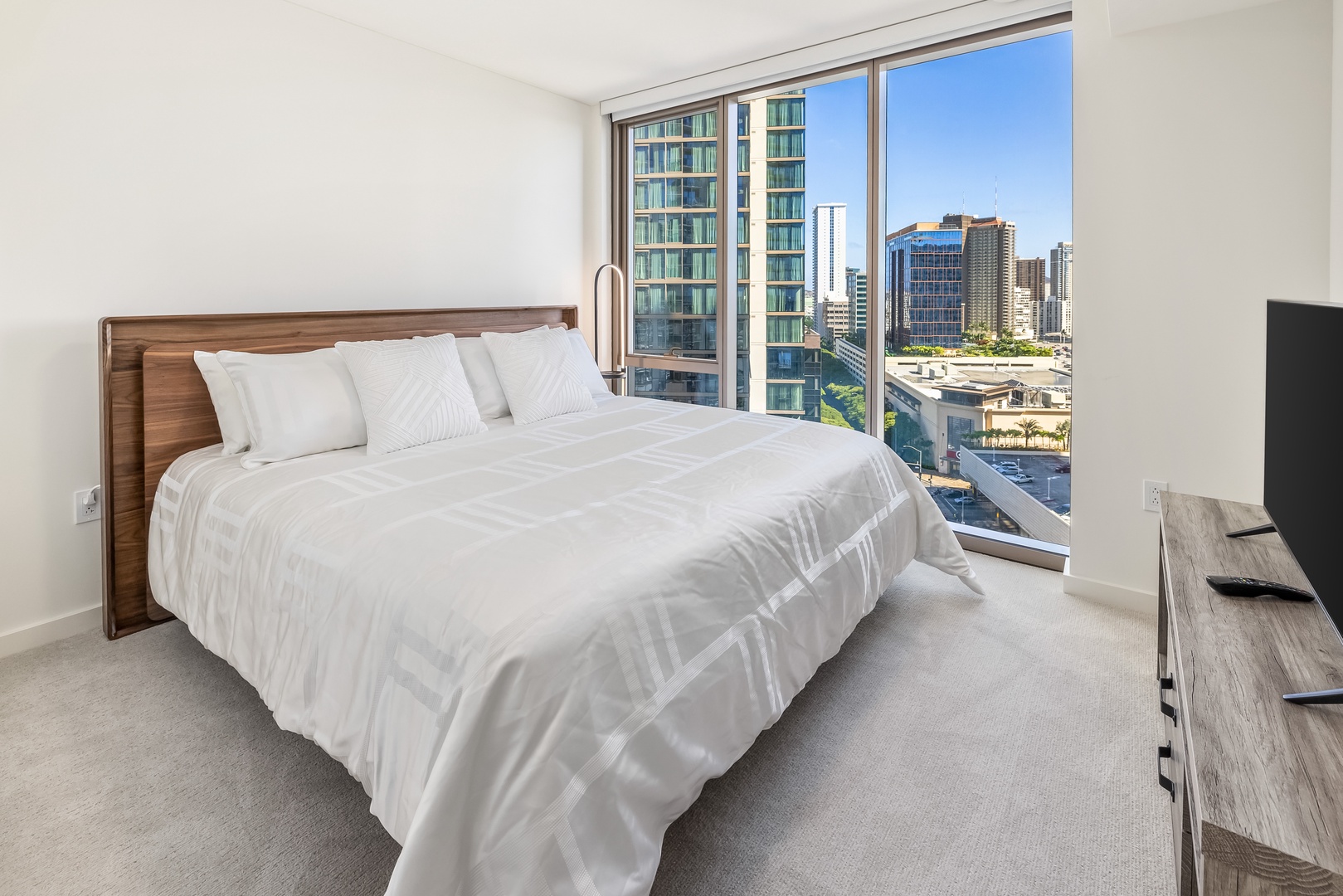 Honolulu Vacation Rentals, Sky Ala Moana #1701 - The second guest suite has a king-sized bed and outdoor views.