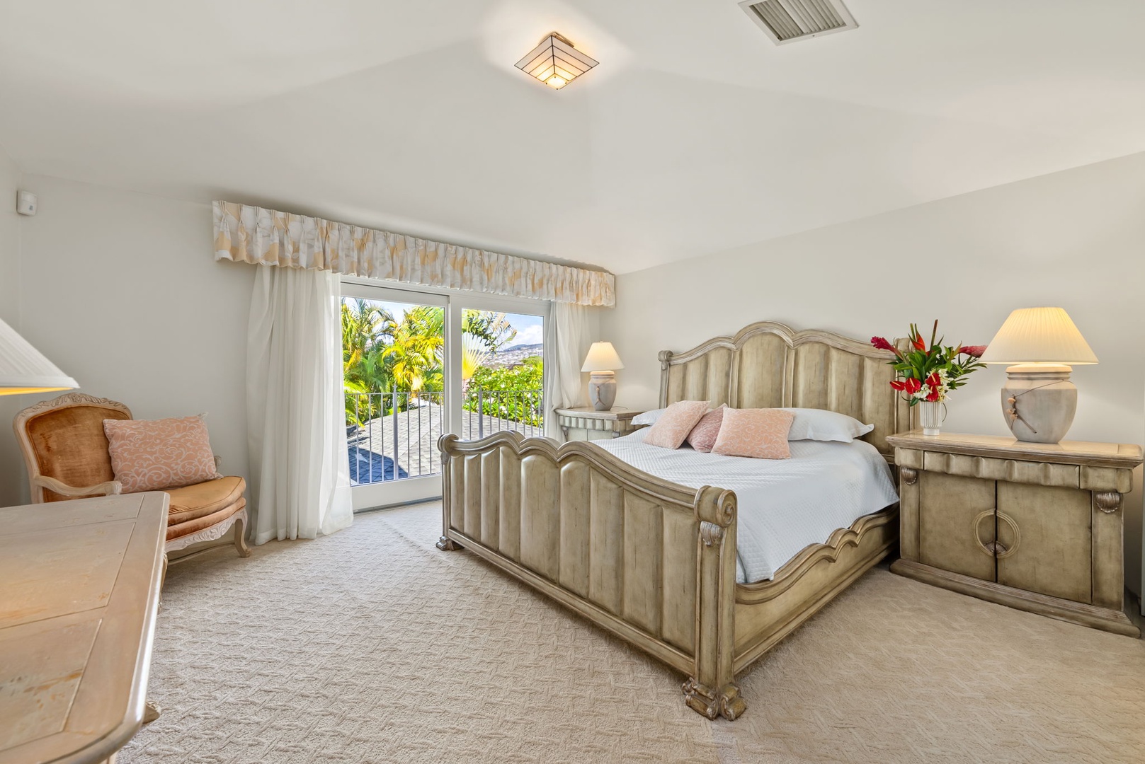 Honolulu Vacation Rentals, Kahala Oasis - Charming fourth guest suite with a classic king-sized bed and French doors leading to a private balcony with tropical views.