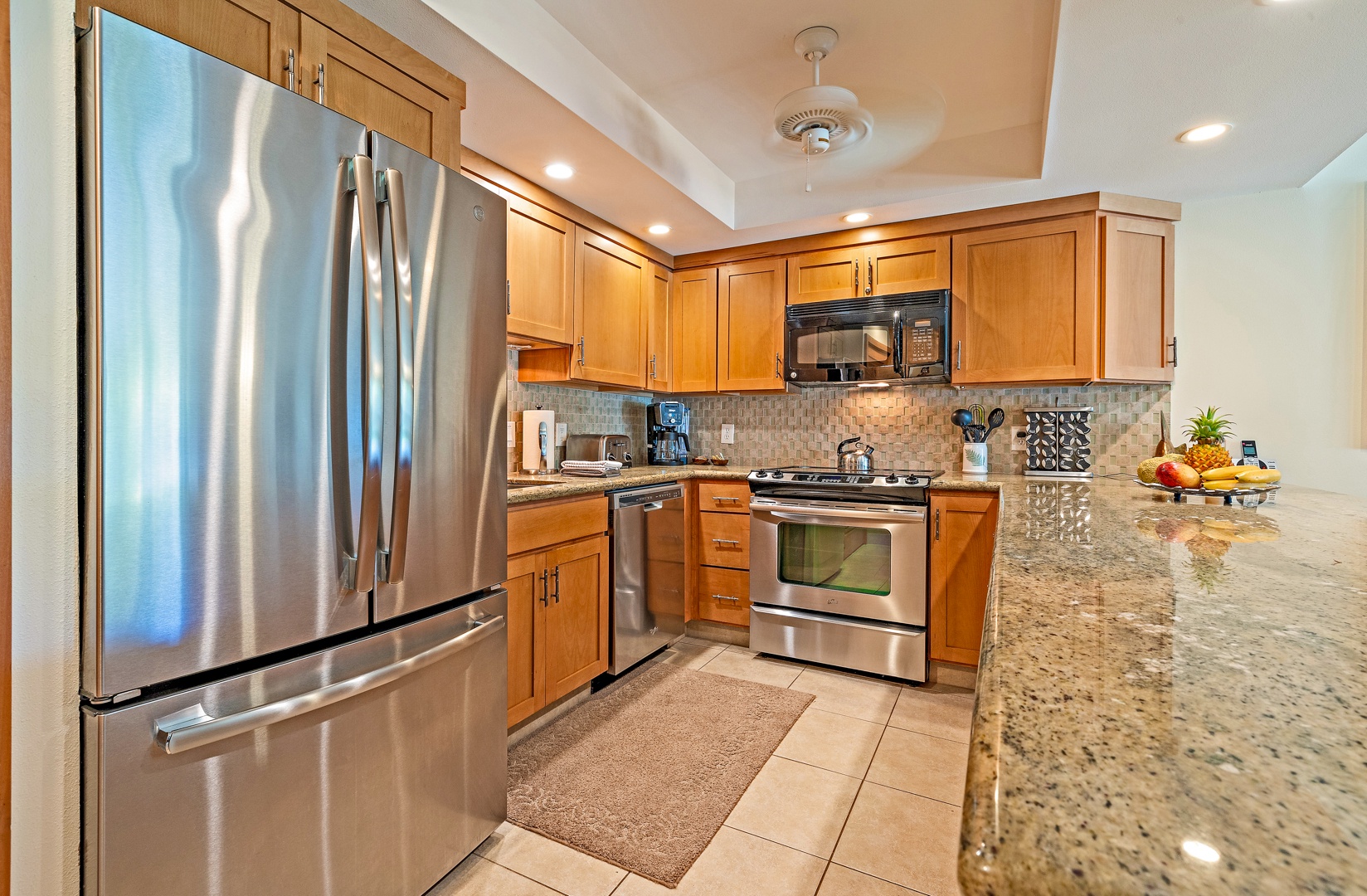 Lahaina Vacation Rentals, Kahana Sunset B4B - The fully equipped kitchen features stainless steel appliances, granite countertops, and ample cabinetry.