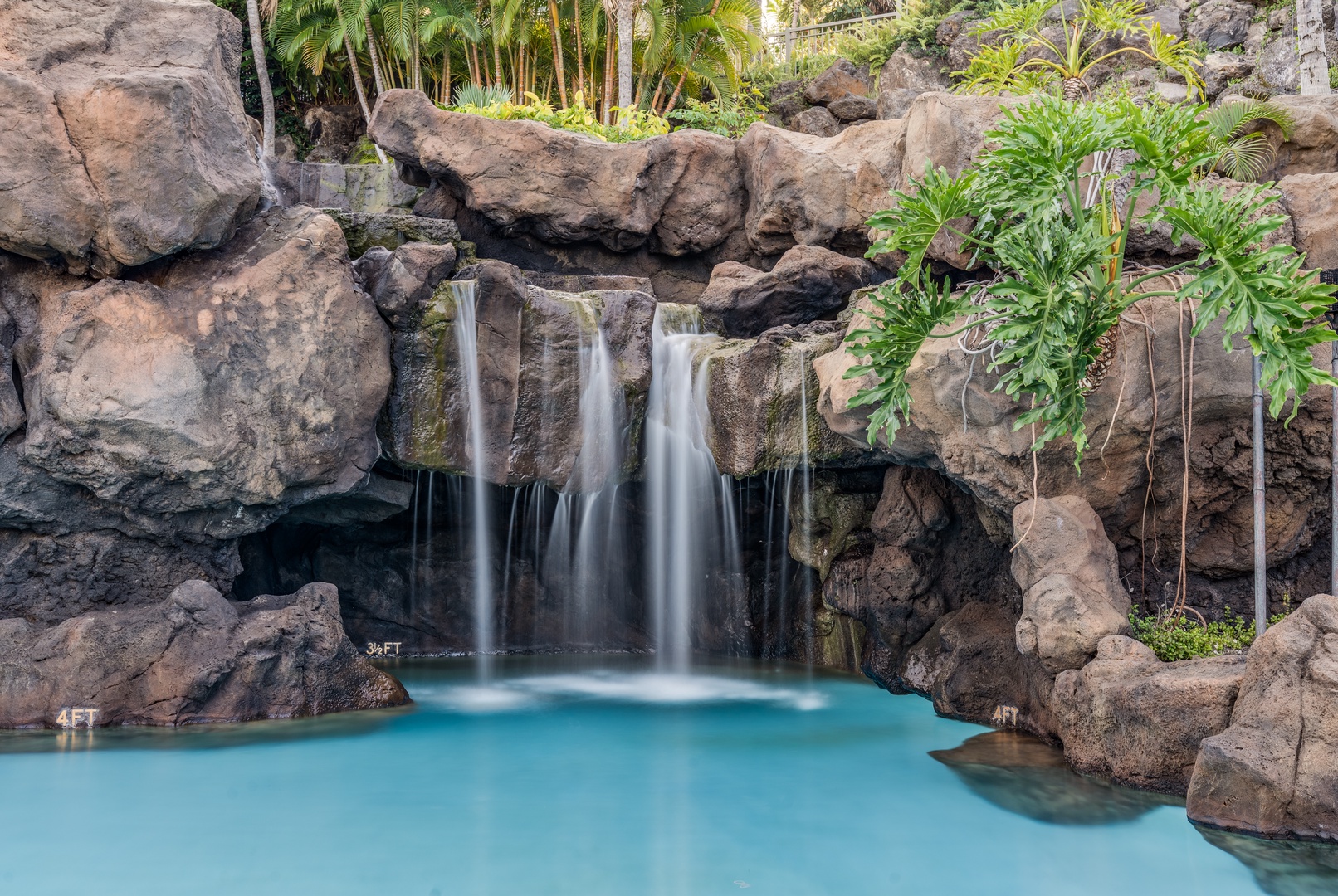 Wailea Vacation Rentals, Wailea Luxury Residence Hoolei 93-3 - Cool off in the pool at Wailea Hoolei Resort, featuring waterfalls and lush palm surroundings.