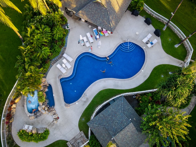 Kapolei Vacation Rentals, Kai Lani 24B - Go for a swim in the sparkling waters and rest in the lounge chairs at the pool.