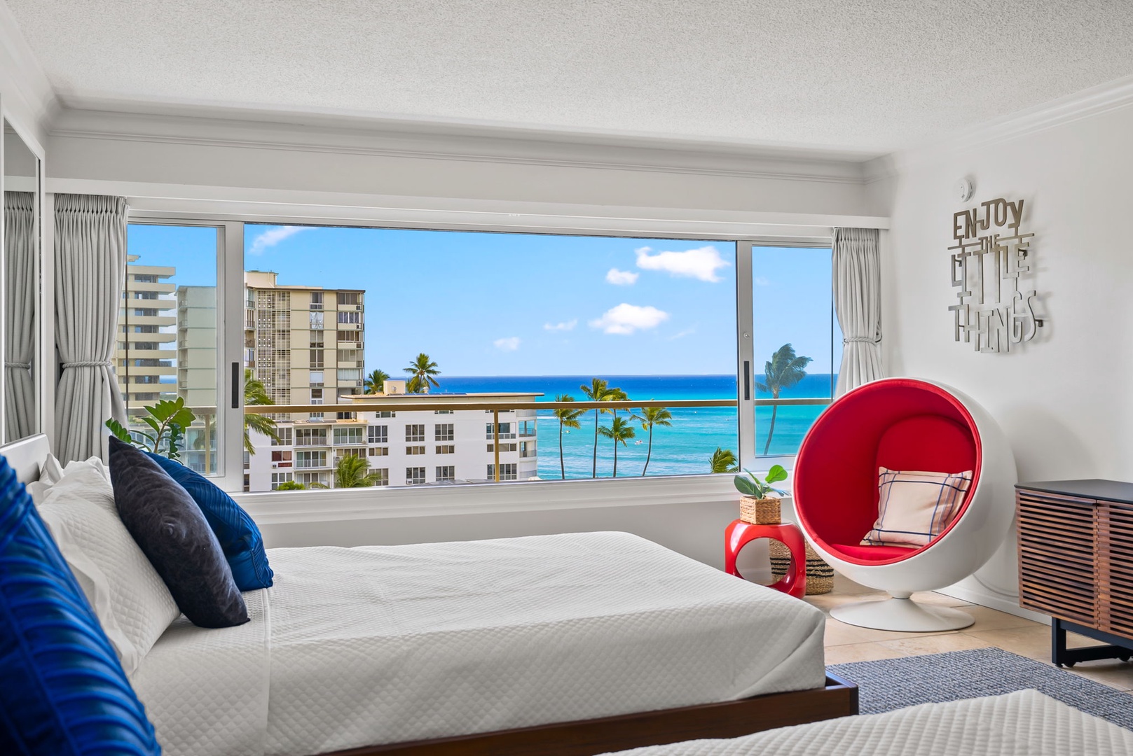 Honolulu Vacation Rentals, Colony Surf Getaway - Wake up to blue skies and coastal views from the guest bedroom.