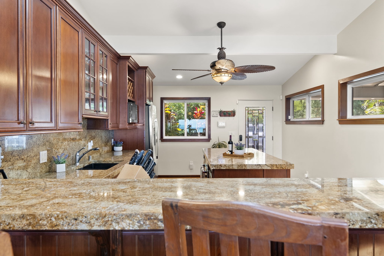 Waialua Vacation Rentals, Hale Oka Nunu - The kitchen has everything you need to prepare meals and has breakfast bar seating