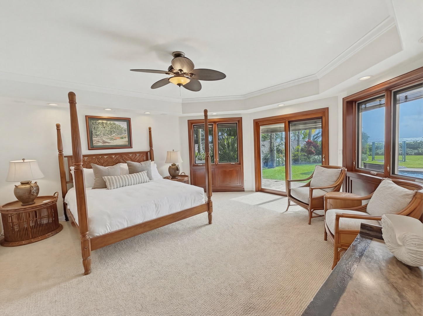 Honolulu Vacation Rentals, Maunalua Estate - Unwind in your elegant bedroom where tropical breezes flow through expansive windows and rich wood details create warmth.