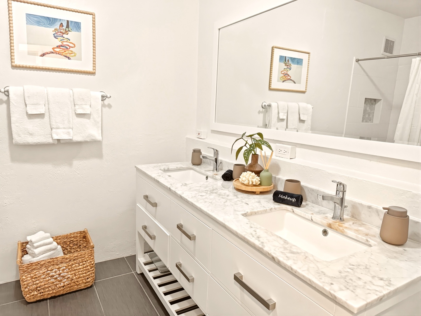 Honolulu Vacation Rentals, Ho'okipa Villa - Pamper yourself in this spa-like bathroom with dual sinks, marble counters, and thoughtful touches that make your morning routine feel luxurious.