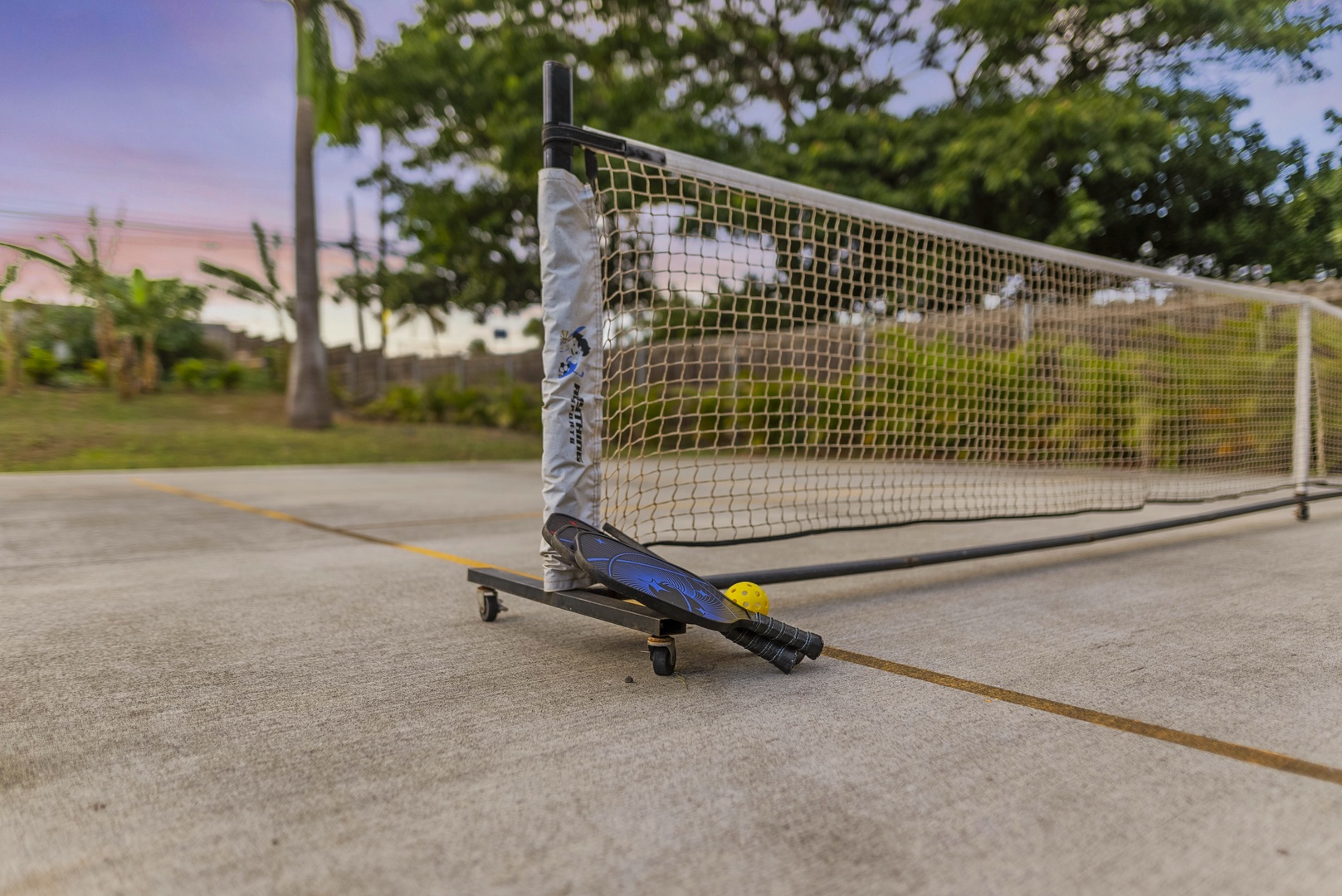 Haleiwa Vacation Rentals, Sunset Pickleball Paradise - Pickleball net set up for competitive and casual games adds excitement to your outdoor experience.