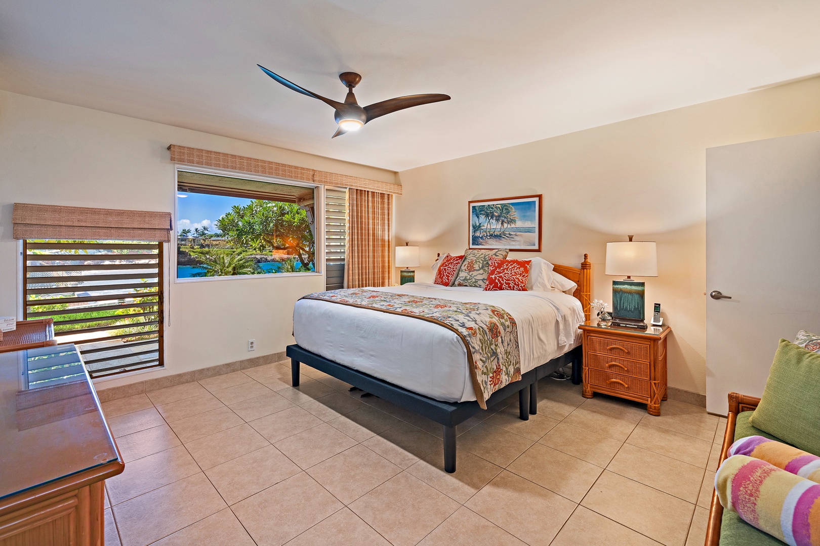 Lahaina Vacation Rentals, Kahana Sunset B4B - The spacious primary bedroom features a comfortable bed, tiled flooring, and large windows offering views of the tropical surroundings, creating a serene retreat.