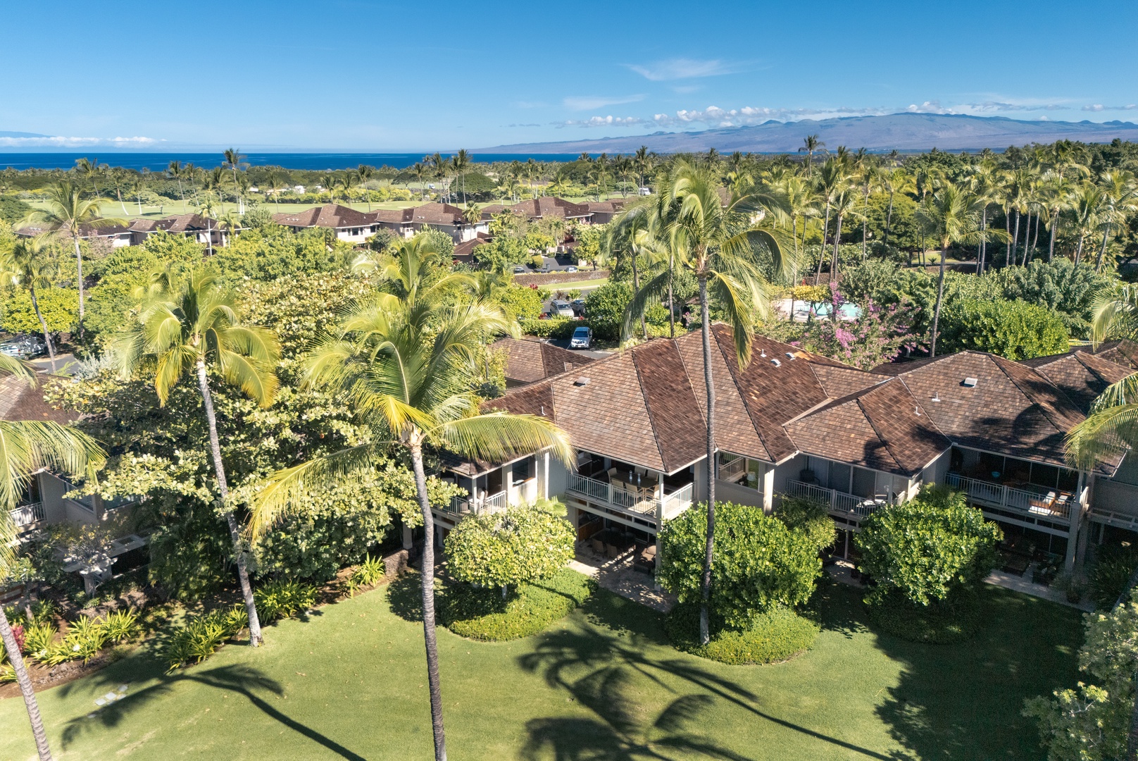 Kailua Kona Vacation Rentals, 3BD Waiulu Villa 111D at Hualalai Resort - Elevated view showcasing the tranquil villa complex and scenic greenery.