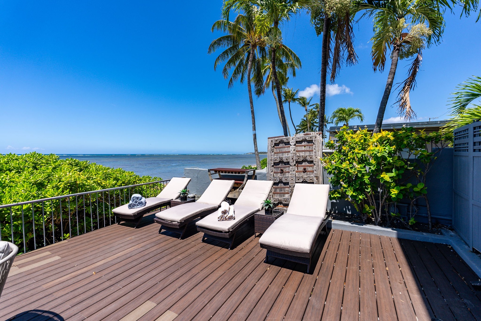 Honolulu Vacation Rentals, Wailupe Beachfront Getaway - Relax on the chaise loungers on the deck and soak up the Hawaii sun.