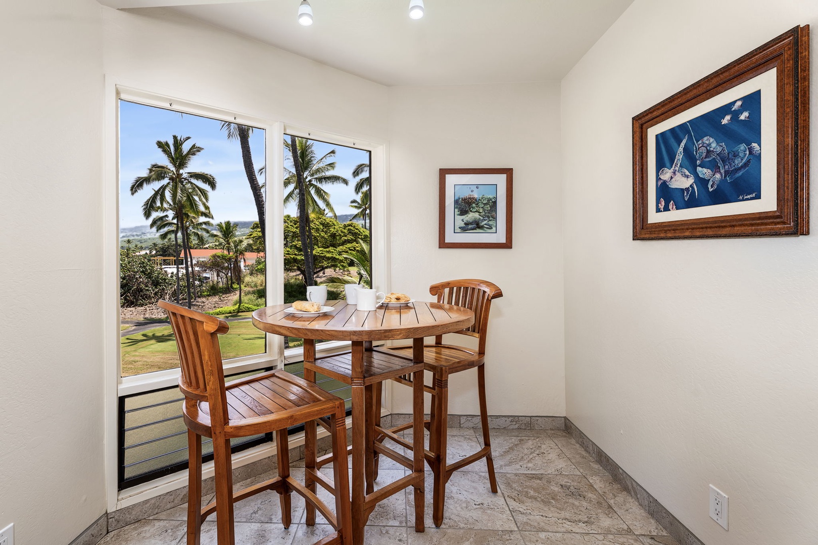 Kailua Kona Vacation Rentals, Kanaloa at Kona 1606 - A small table for two by the window, the greens rolling out just outside.