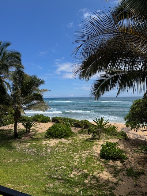 Hanalei Vacation Rentals, Hale Kepuhi - Enjoy serene ocean views just beyond the landscaped lawn, perfect for quiet mornings or sunset strolls.