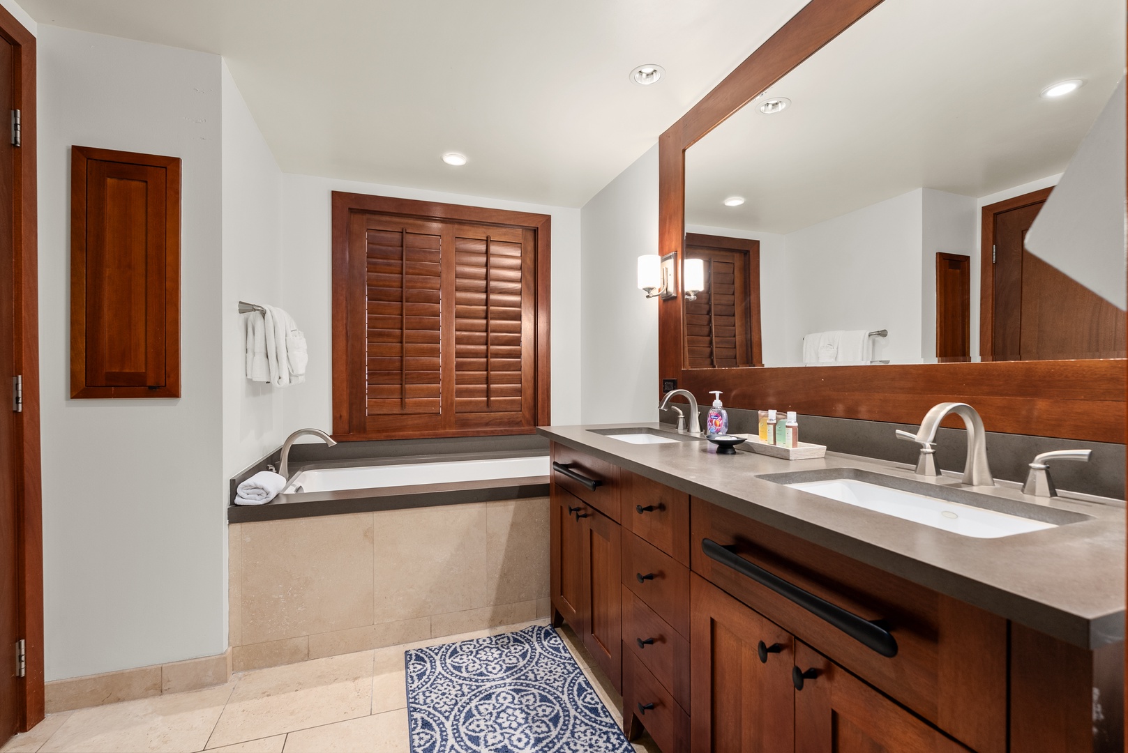 Side-by-side sinks handle two people getting ready for the same reservation.