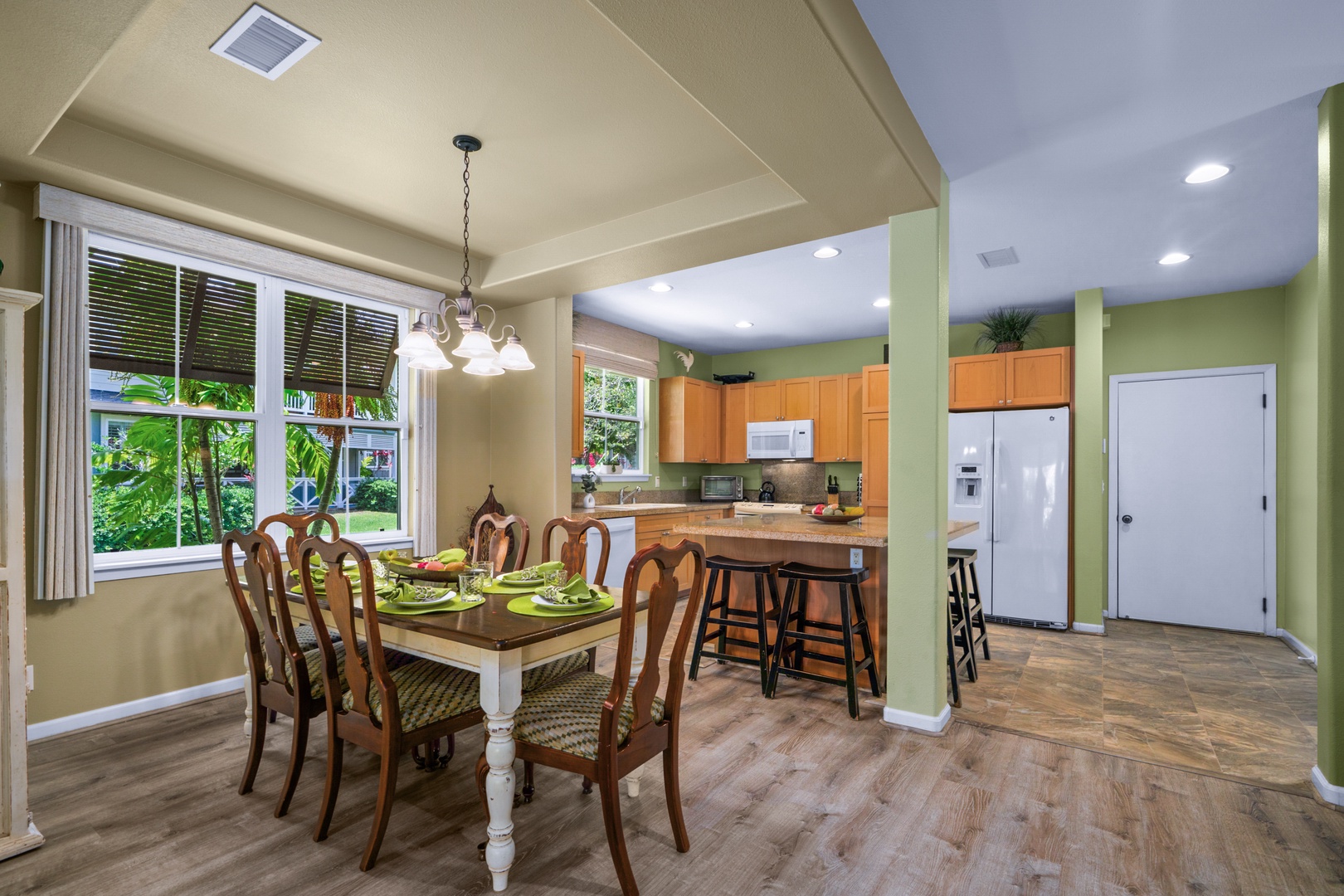 Princeville Vacation Rentals, Kaimana Villa - Gather around this inviting dining table where your group can share meals and make memories in this bright, open-concept space.