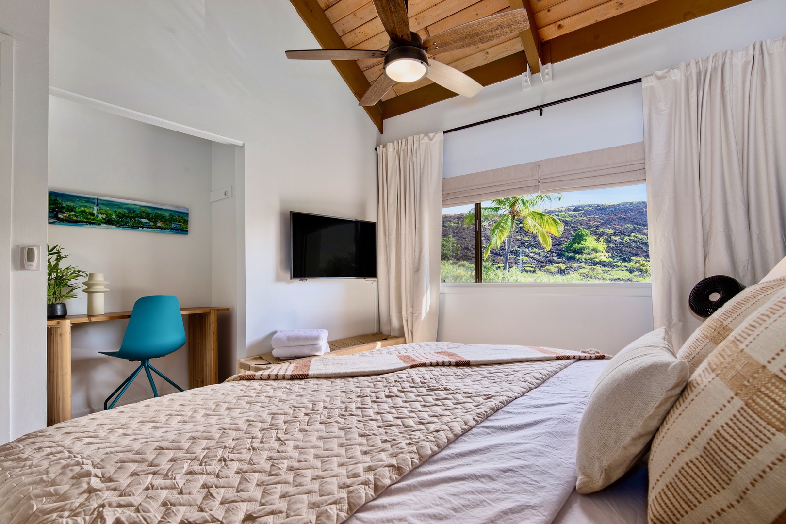 Kailua Kona Vacation Rentals, Keauhou Kai C301 - Vaulted ceiling, fan turning, and a window full of green from the pillow.