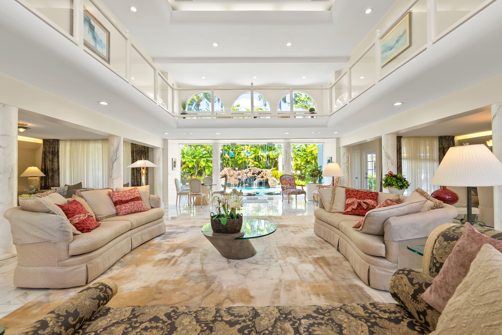 Honolulu Vacation Rentals, Kahala Oasis - Spacious living room with vaulted ceilings, elegant furnishings, and abundant natural light for a luxurious setting.