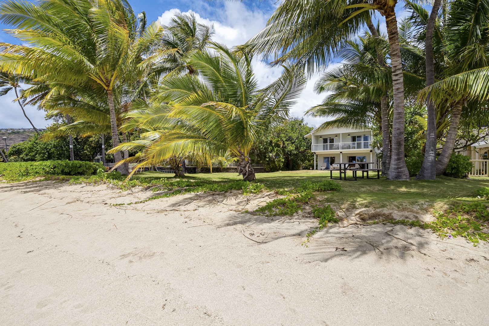 Honolulu Vacation Rentals, Honolulu Beachfront Retreat - Private sandy beach just steps from the property, offering a serene spot for sunbathing, sandcastles, or peaceful strolls along the shore.