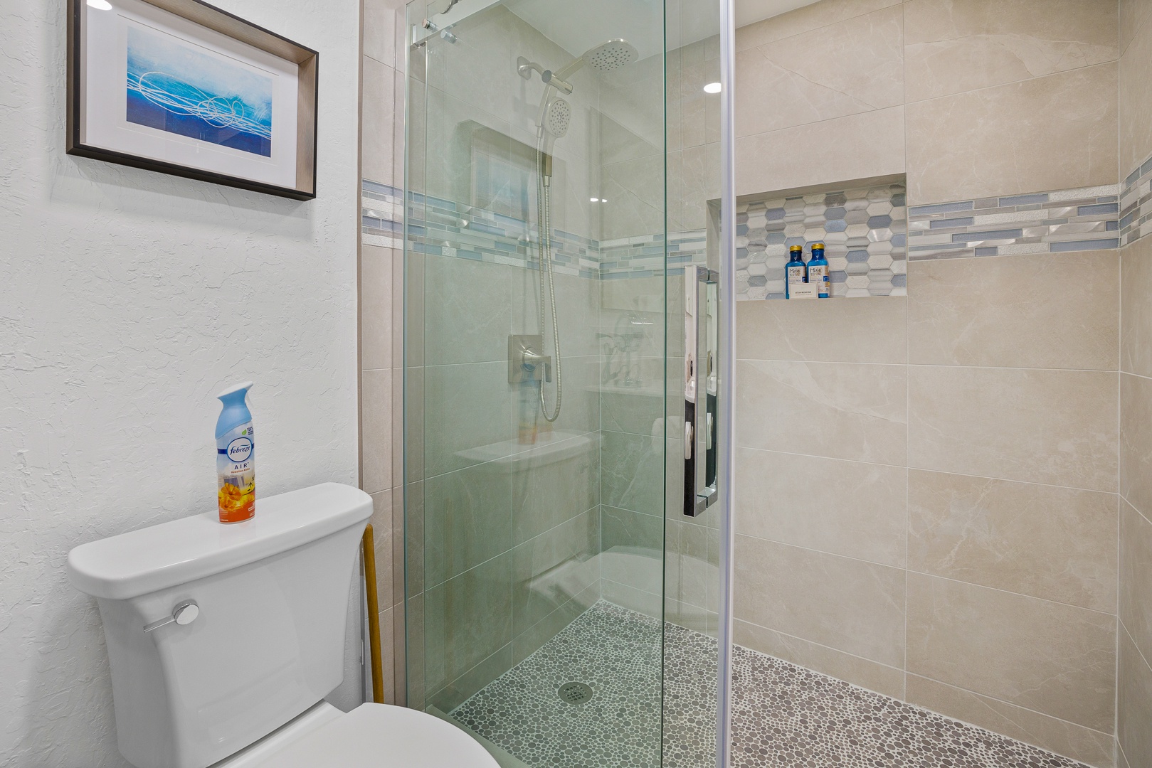 Lahaina Vacation Rentals, Kaanapali Shores 213 - Stylish bathroom with elegant tilework and a sleek, glass-enclosed shower at Kaanapali Shores 213
