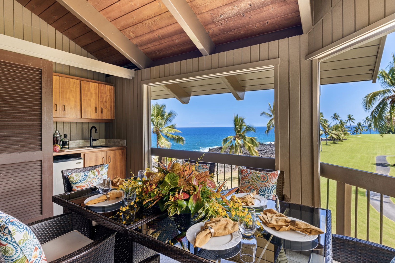 Kailua Kona Vacation Rentals, Kanaloa at Kona 1606 - A table set for six on the lanai, ocean framed just past the railing.