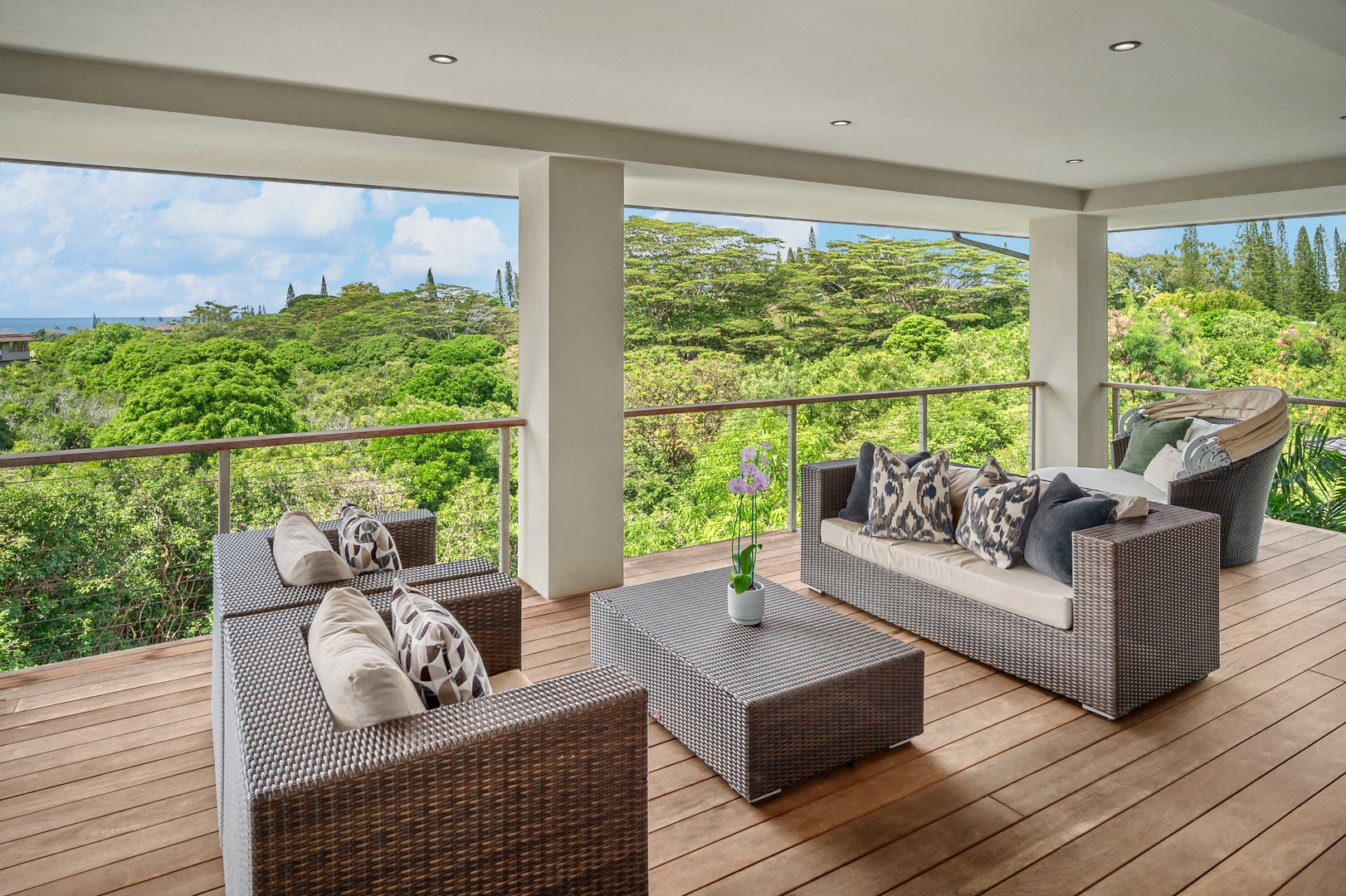 Princeville Vacation Rentals, Hanalei Plantation Villa - Upper level outdoor seating area with cozy furniture, perfect for enjoying scenic views and fresh air.