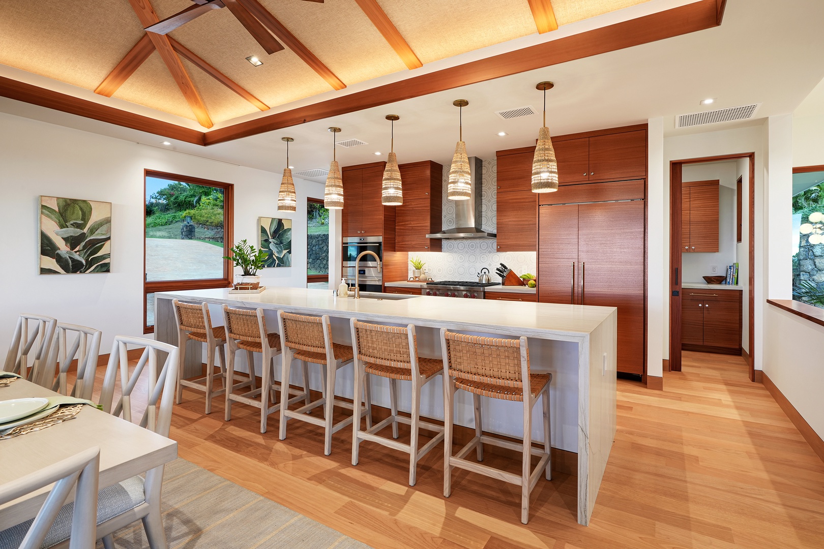 Koloa Vacation Rentals, Hale Kai'Opua - Create culinary delights in this spacious open-concept kitchen with top-tier finishes.