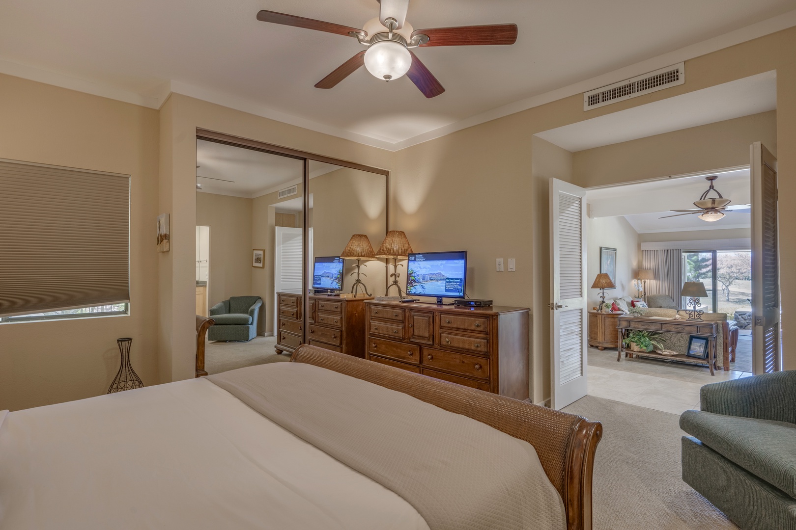 Lahaina Vacation Rentals, Kapalua Golf Villas 14P1-2 - Cozy corner of the primary bedroom with TV and reading chair—perfect for evening relaxation.