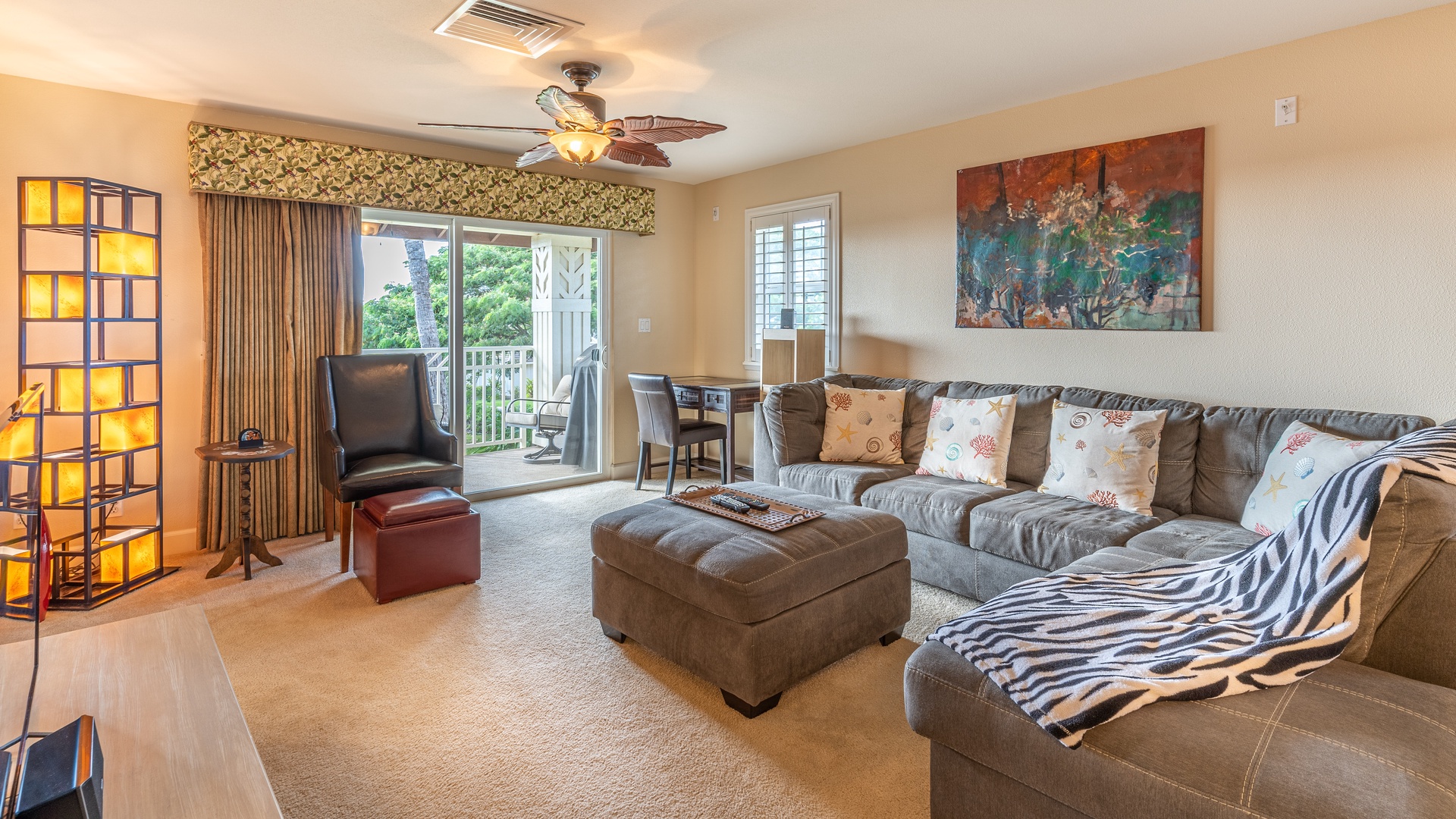 Kapolei Vacation Rentals, Ko Olina Kai 1065E - Sink in to the plush couch in the living area for movie night on TV.